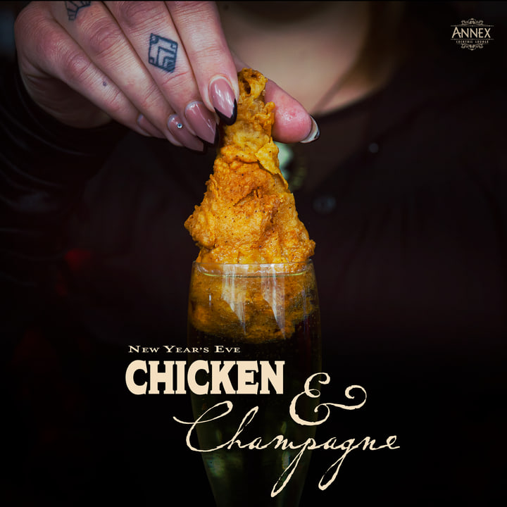 Chicken & Champagne graphic with a hand holding fried chicken