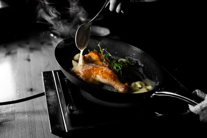 Game hen basting in a skillet