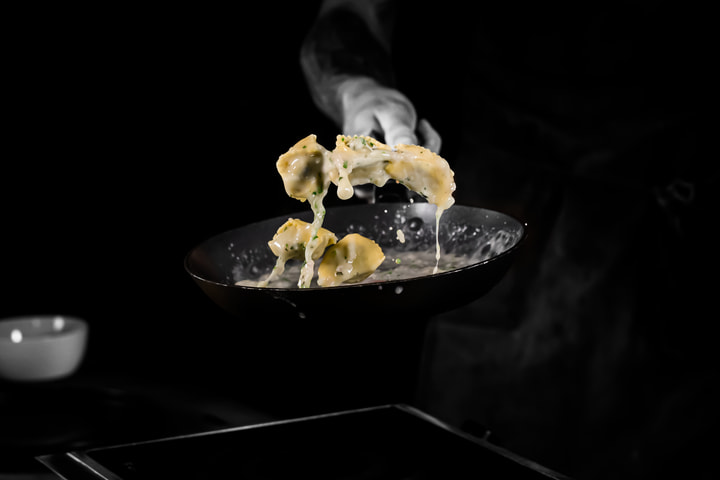 Pasta tossed from a pan