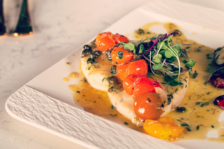 Swordfish on a white plate