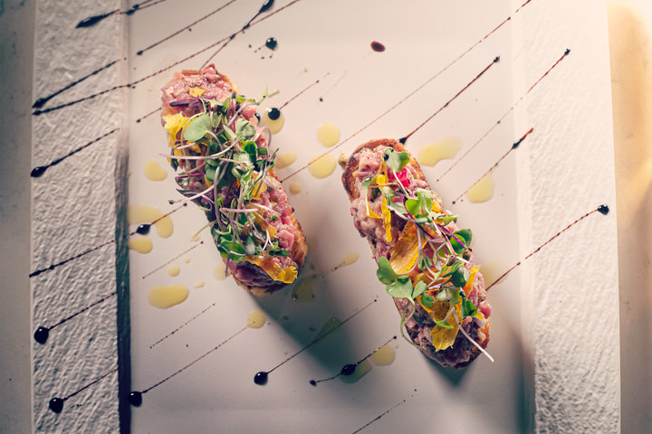 Overhead view of two tartare toasts