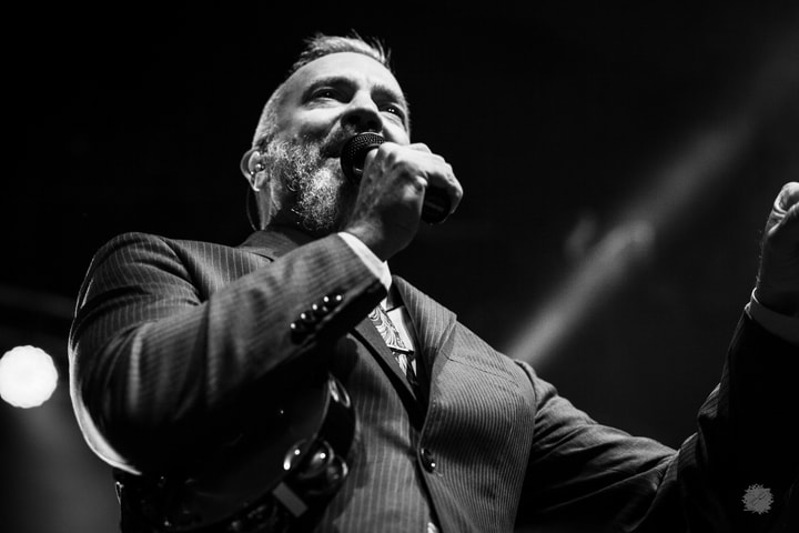 Singer holding a microphone, black and white