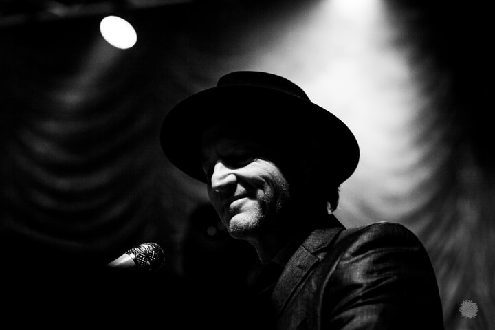 Musician in a hat, black and white